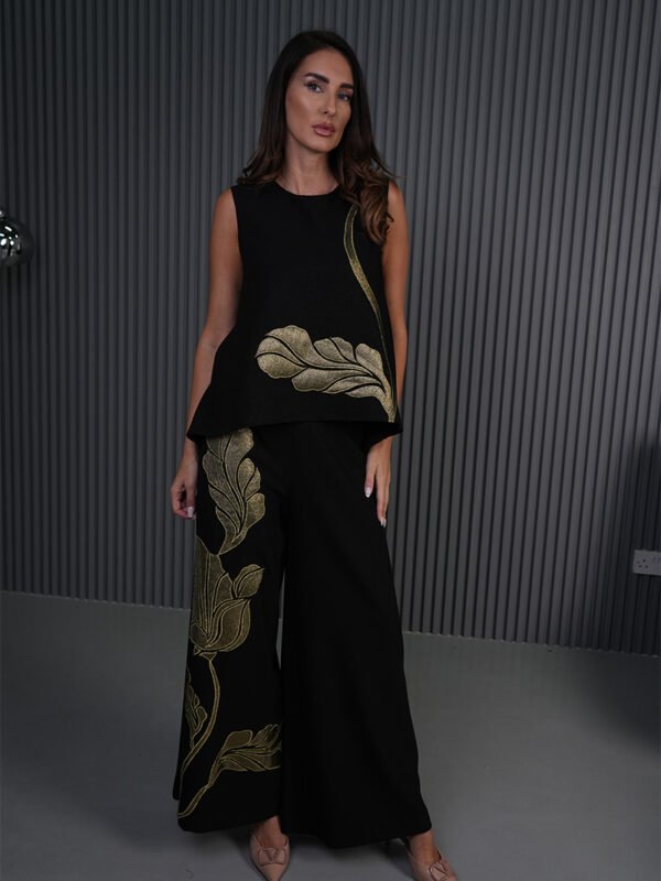 Elegant women's wear Gold leaf detailing Embroidered evening wear Sophisticated party outfit Designer fashion ensemble