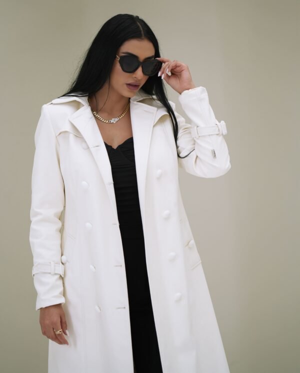 ivory-elegance-mantle-front-view – Woman modeling an ivory mantle coat with a structured silhouette